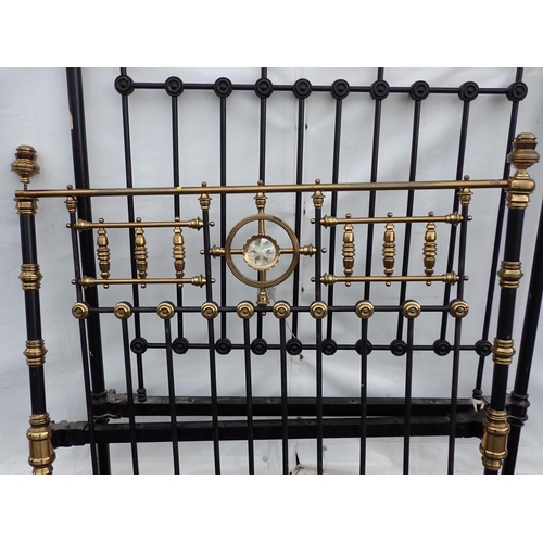 842 - A Victorian black painted metal and brass Bed 4ft 6in W