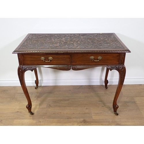 750 - A mahogany Side Table with trailing foliate carved top fitted two frieze drawers mounted upon cabrio... 