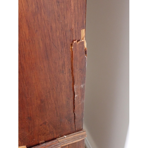 10 - A 19th Century mahogany Linen Press fitted pair of cupboard doors above base of two short and two lo... 