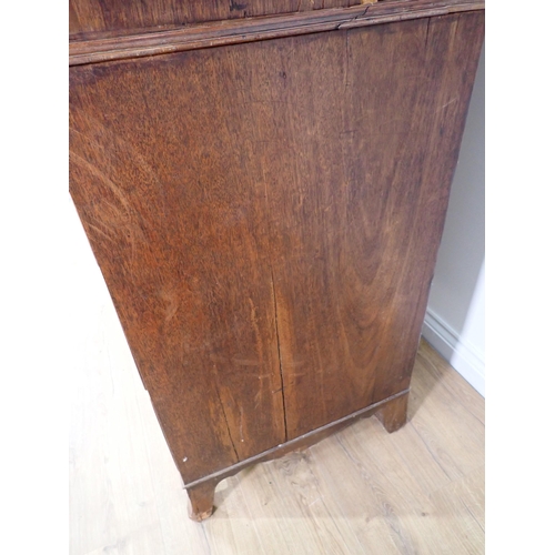 10 - A 19th Century mahogany Linen Press fitted pair of cupboard doors above base of two short and two lo... 