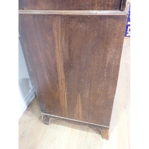 10 - A 19th Century mahogany Linen Press fitted pair of cupboard doors above base of two short and two lo... 