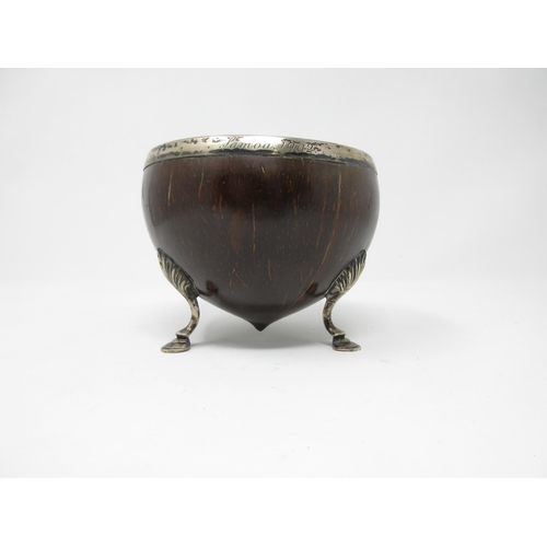 101 - A white metal mounted Coconut Cup, engraved Samoa 1902, on cabriole supports and hoof feet, 5in diam