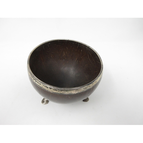 101 - A white metal mounted Coconut Cup, engraved Samoa 1902, on cabriole supports and hoof feet, 5in diam