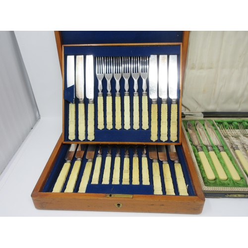 117 - One dozen plated Knives and Forks with carved ivory handles, in mahogany case, six Fish Knives and F... 