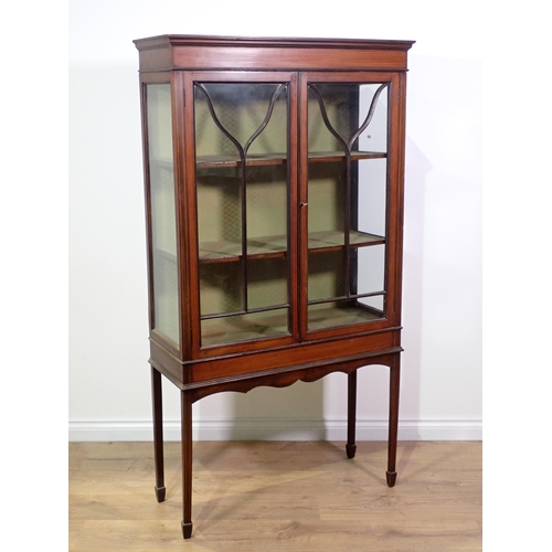 13 - An Edwardian mahogany and boxwood strung Display Cabinet fitted pair of glazed doors on square cut s... 