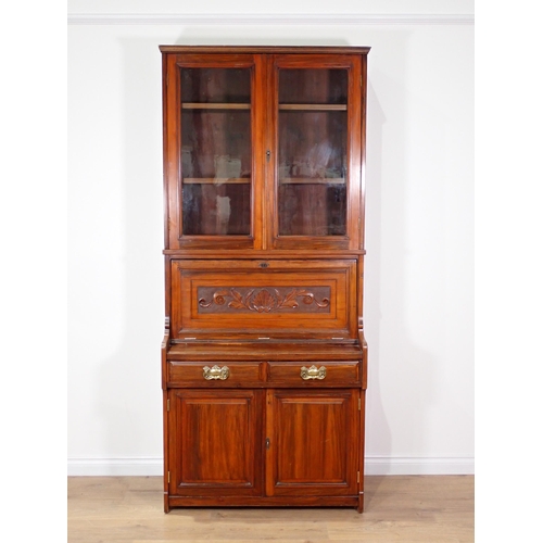 14 - A Victorian walnut Secretaire Bookcase fitted pair of glazed doors enclosing adjustable shelves abov... 