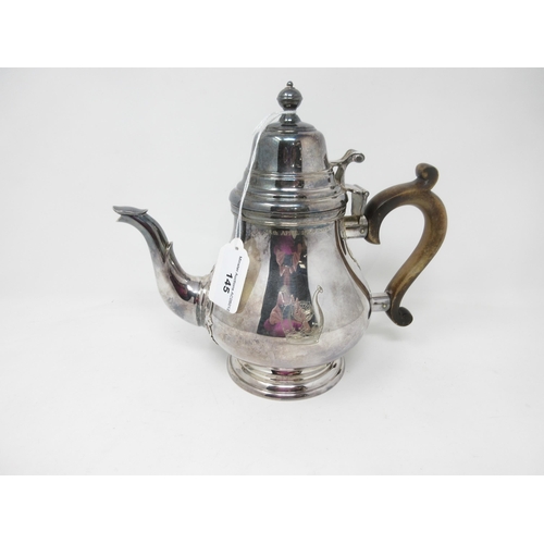 145 - An Elizabeth II silver Teapot in the early Georgian style, engraved bird crest and inscription, dome... 