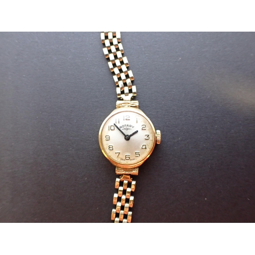 162 - A lady's Rotary Wristwatch the silvered dial with arabic numerals in 9ct gold case on 9ct gold brick... 