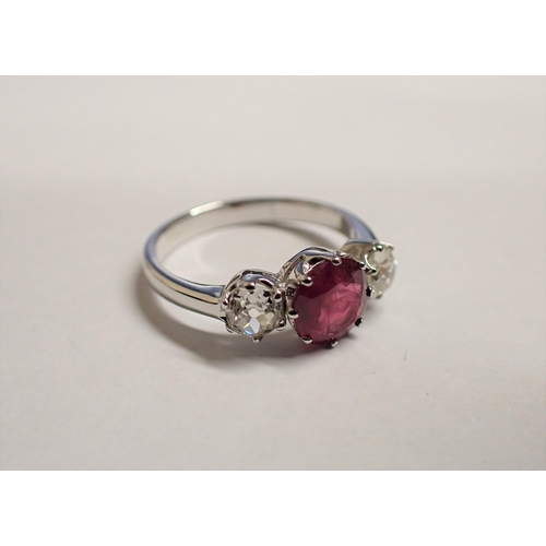 175 - A Ruby and Diamond three stone Ring claw-set round ruby between two old-cut diamonds in platinum, ri... 