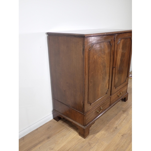 24 - A George III mahogany Press Cupboard fitted pair of doors enclosing slides above two drawers all mou... 