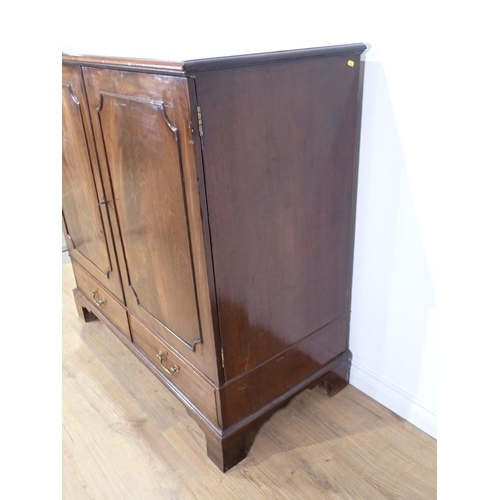 24 - A George III mahogany Press Cupboard fitted pair of doors enclosing slides above two drawers all mou... 