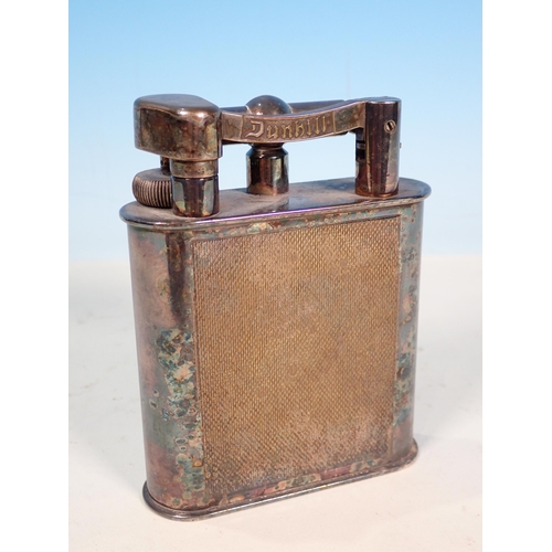 288 - A Dunhill silver plated lift arm Table Lighter, signed to the arm and the underside, 10.5cm H