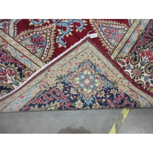 298 - A Persian style Carpet of multi-bordered design with central star on a red ground, 13ft 4in x 9ft 8i... 