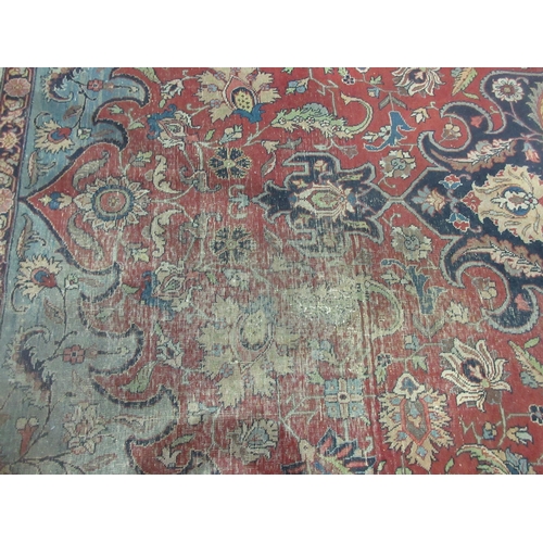 299 - A Persian Carpet of multi-bordered design with floral and scrolled design, on a red ground, 11ft 5in... 