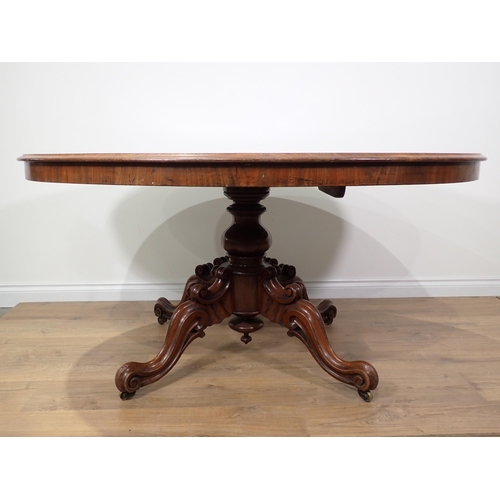 304 - A Victorian mahogany oval Loo Table on quadruple supports 4ft 11in W x 2ft 5in H