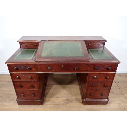 315 - A Victorian mahogany twin pedestal Desk with sloped leather inset writing surface fitted nine drawer... 