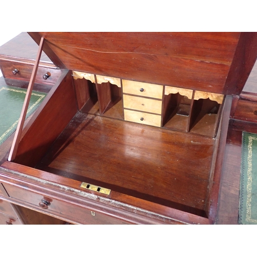 315 - A Victorian mahogany twin pedestal Desk with sloped leather inset writing surface fitted nine drawer... 