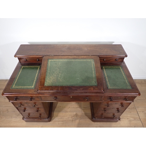 315 - A Victorian mahogany twin pedestal Desk with sloped leather inset writing surface fitted nine drawer... 