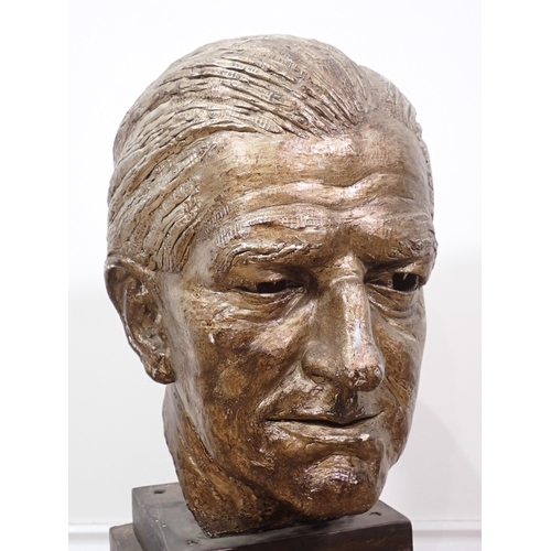 335 - A bronze effect Sculpture of a male head on stand 1ft 10in H