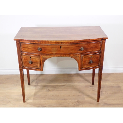 342 - A Regency mahogany and satinwood strung bow fronted Serving Table fitted three drawers mounted upon ... 