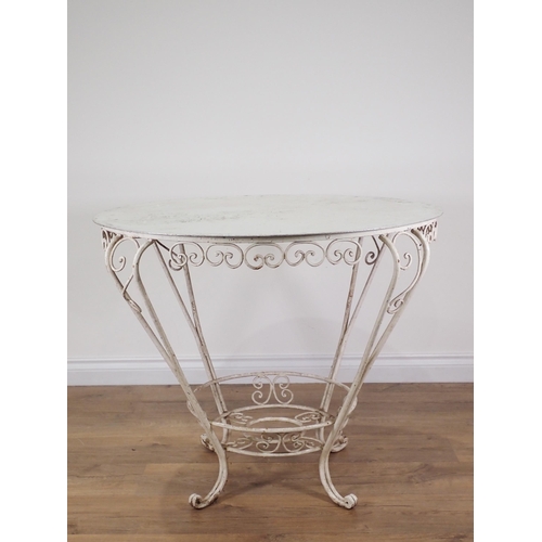 346 - A white painted metal circular Garden Table 2ft 9in D x 2ft 3in H