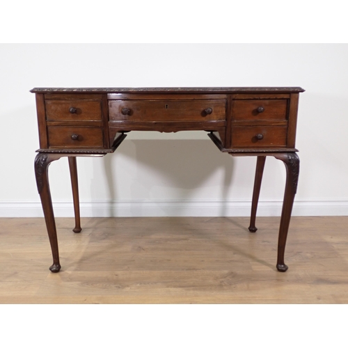 348 - An Edwardian mahogany Desk with green leather inset writing surface above five drawers mounted upon ... 