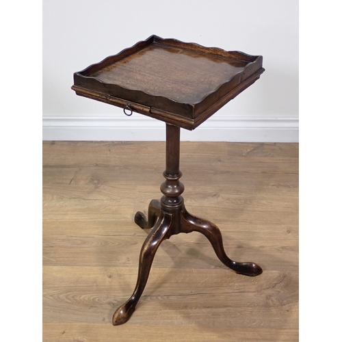 355 - A Georgian mahogany Kettle Stand with slide mounted upon turned column and tripod supports terminati... 