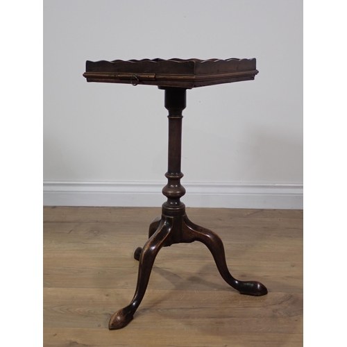 355 - A Georgian mahogany Kettle Stand with slide mounted upon turned column and tripod supports terminati... 