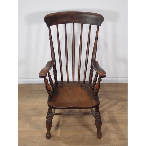 365 - A 19th Century ash and elm spindle back Kitchen Armchair 3ft 6in H x 1ft 9in W