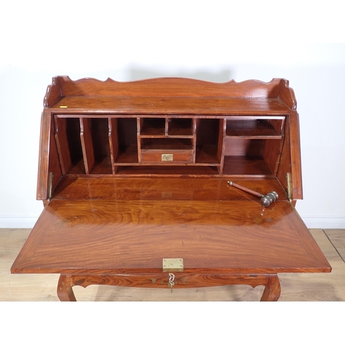 369 - A 20th Century hardwood and brass inlaid Bureau with fall front above four short and one long drawer... 