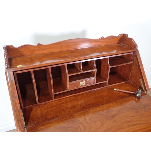 369 - A 20th Century hardwood and brass inlaid Bureau with fall front above four short and one long drawer... 