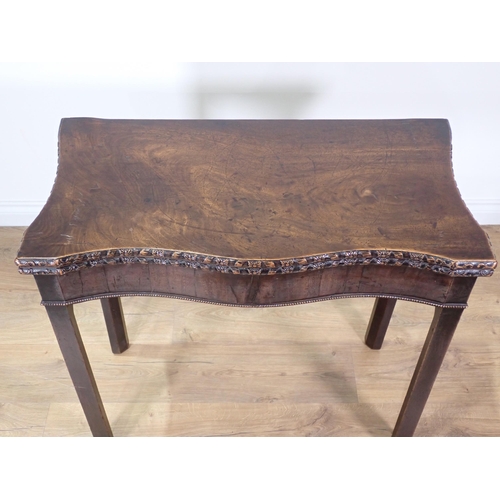 372 - A George III mahogany fold-over Card Table with floral carved edge and rope twist moulded lower frie... 