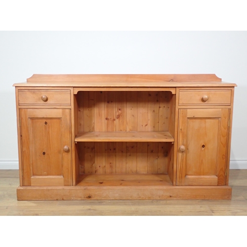 382 - A modern pine Bookcase fitted two frieze drawers and two cupboard doors 5ft 2in W x 3ft 1in H