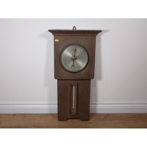 385 - An oak cased Aneroid Barometer and Thermometer 2ft 5in H