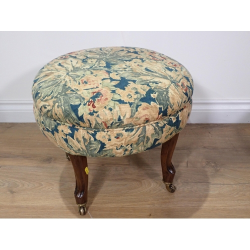 388 - A Victorian circular Footstool with blue floral upholstery mounted on mahogany supports and another ... 