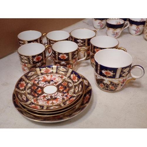 457 - A collection of Royal Crown Derby Coffee Cans and Saucers and a Derby style gily part Tea Service