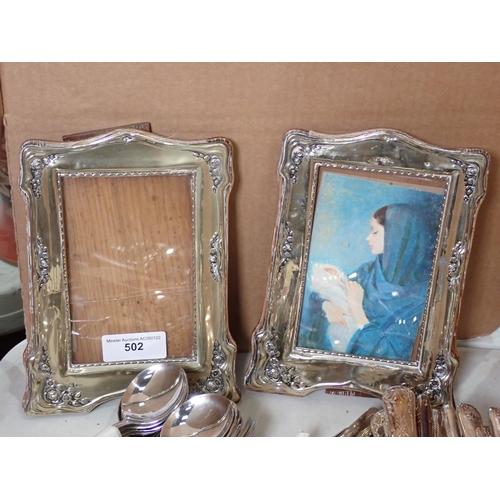 502 - Two plated Photo Frames and a quantity of Cutlery including Knives, Forks and Spoons