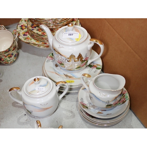 507 - A Japanese egg shell Tea Set and a Winton 'Evesham' Tea Service