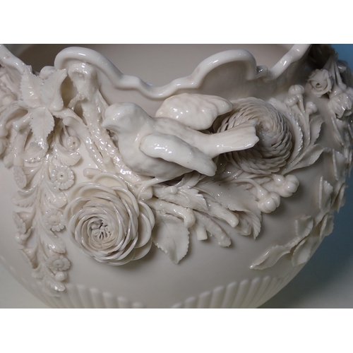 523 - A Belleek floral encrusted globular Vase 7 1/2in H