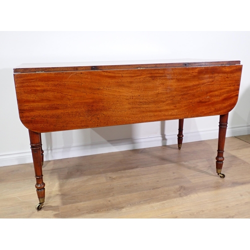 533 - A 19th Century mahogany dropleaf Table mounted upon turned supports and casters 4ft W x 2ft 6in H