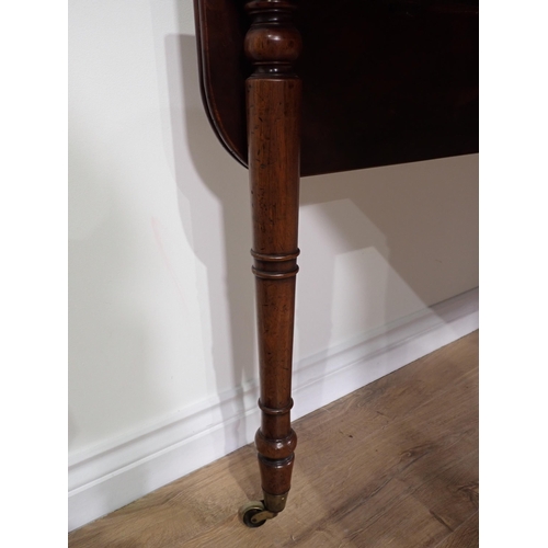 533 - A 19th Century mahogany dropleaf Table mounted upon turned supports and casters 4ft W x 2ft 6in H