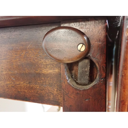 533 - A 19th Century mahogany dropleaf Table mounted upon turned supports and casters 4ft W x 2ft 6in H