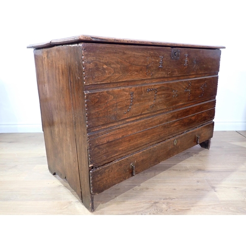 534 - An 18th Century elm Mule Chest of plank construction  with studwork date '1745' fitted lower drawer ... 