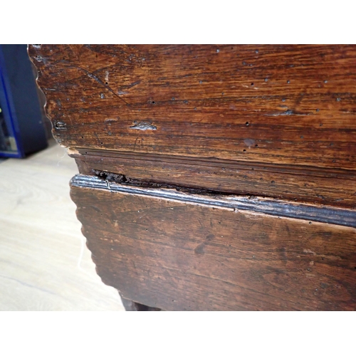 534 - An 18th Century elm Mule Chest of plank construction  with studwork date '1745' fitted lower drawer ... 