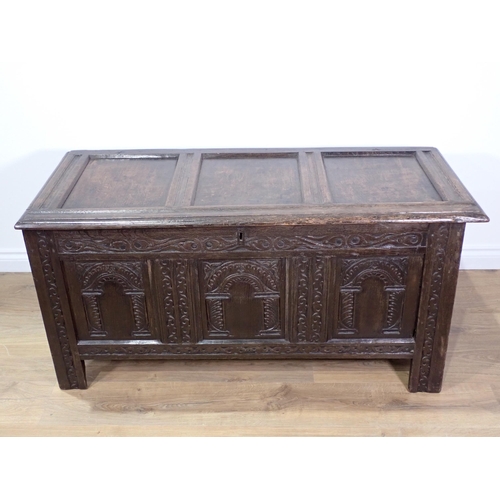 535 - A late 17th Century joined oak Coffer with sunken three panel lid above front with three arched carv... 