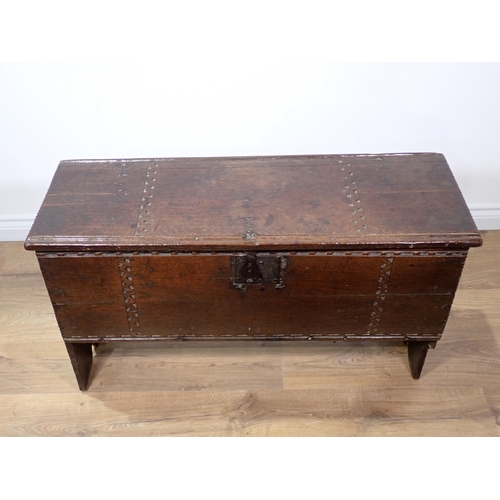 549 - A 17th Century oak six plank Chest with thumb cut strap design mounted on V-cut end supports 3ft 3in... 