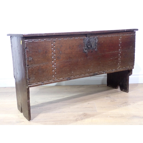 549 - A 17th Century oak six plank Chest with thumb cut strap design mounted on V-cut end supports 3ft 3in... 