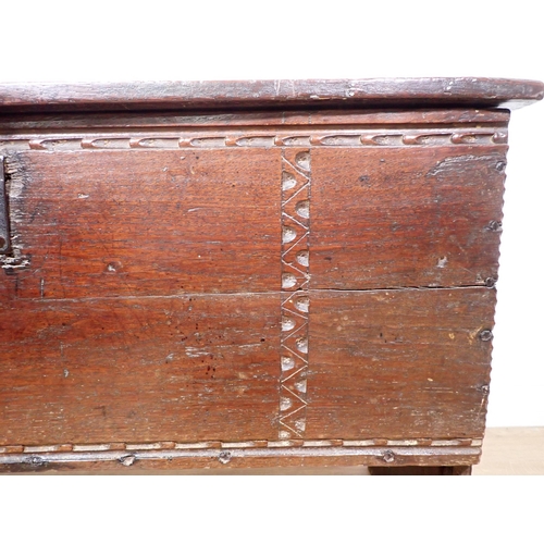 549 - A 17th Century oak six plank Chest with thumb cut strap design mounted on V-cut end supports 3ft 3in... 