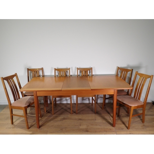 555 - A modern extending Dining Table and six Chairs