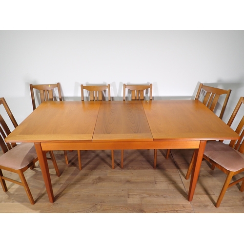 555 - A modern extending Dining Table and six Chairs